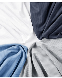 Close-up of breathable ice silk fabric with micro-ventilation holes in four colors