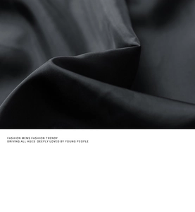 Close-up of black PU leather jacket fabric texture with premium stitch and subtle sheen