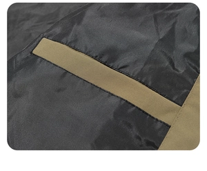 Detailed view of durable khaki fabric with waterproof black lining on a men's jacket