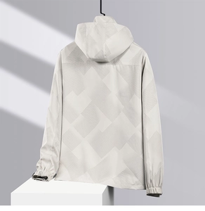 Detail of waterproof men's hooded jacket featuring geometric textures and elastic cuffs