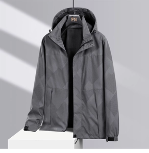 Detail of grey outdoor jacket featuring breathable black mesh lining and geometric pattern
