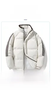 Detailed close-up of stand-up collar and brown striped sleeves on warm padded jacket