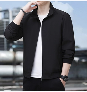 Detail of black casual men jacket featuring a ribbed standing collar and metal zipper