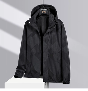 Close-up of black windproof jacket with geometric patterns and integrated hood