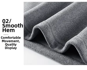 Detailed view of the flat hemline and soft fleece fabric texture on a grey sweatshirt