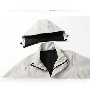 Detail of outdoor jacket showing breathable mesh lining and geometric pattern texture