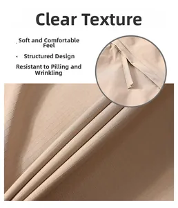Macro detail of khaki ripstop fabric showing durable texture and premium stitching