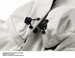 Detail of waterproof jacket fabric with geometric pattern and adjustable drawstring