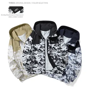 Detail view of khaki and navy windbreakers with unique mountain marble prints