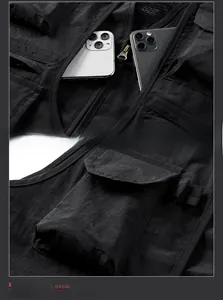 Detail of multi-pocket tactical vest showing flap pocket capacity with phone reference