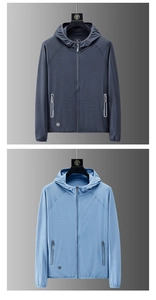 Detail of lightweight hooded sun protection jacket featuring breathable mesh fabric texture
