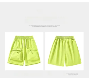 Front and back views of light green cargo shorts with drawstring and utility pockets