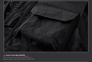 Detailed view of durable flap pocket on a black outdoor fishing vest for storage