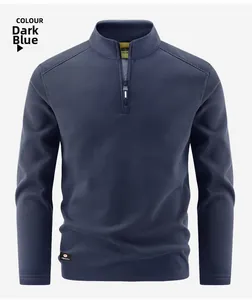 Detail of dark blue fleece pullover with high neck zipper and branded hem label