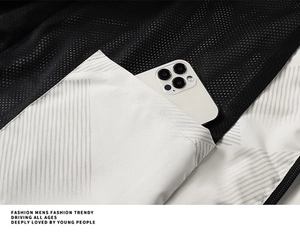 Close-up of the waterproof jacket featuring a deep utility pocket with breathable mesh lining