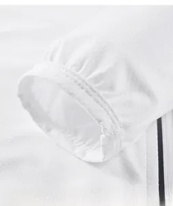 Detailed macro view of white sun protection jacket cuff with breathable mesh texture