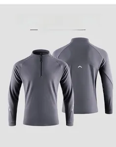Detail of grey men's sports sweatshirt with half-zip collar and reflective back design