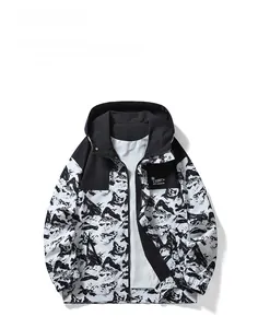 Flat lay of a hooded windbreaker with black and white mountain pattern and chest pocket