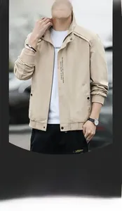 Detailed view of beige casual jacket featuring stand-up collar and vertical print design