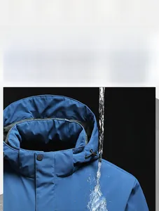 Detail of waterproof blue hooded jacket showing rain resistance and drawstring hood