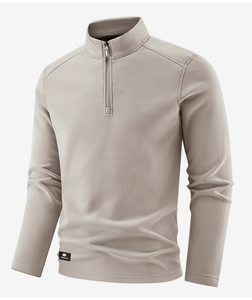 Detail of the high-quality half-zip fleece sweatshirt with a stand-up collar and sports label