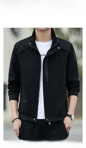 Detail view of a men's black stand collar casual jacket with zipper and button closure
