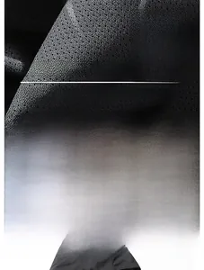 Detailed macro view of dark grey breathable mesh fabric for waterproof outdoor jackets
