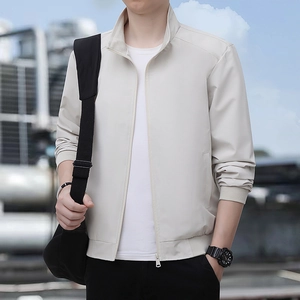 Men casual light beige stand collar jacket with zip front and ribbed cuffs in urban setting