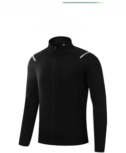 Close-up of black men's sports jacket with standing collar and gray shoulder stripe detail