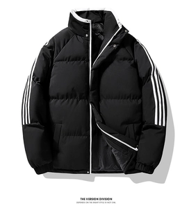 Detail of windproof stand-up collar and white contrast zipper on black padded jacket