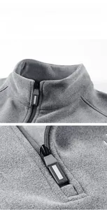 Detail shot of the stand collar and high-quality zipper on grey fleece jacket