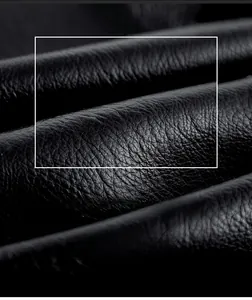 Detailed macro view showing the soft texture and lychee grain of black leather jacket fabric