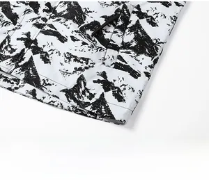Detailed close-up of slim-fit windproof jacket hem with artistic black and white pattern