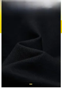 Macro shot of black twill fabric texture showing premium fiber weave and durable material