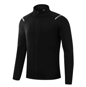 Detail of men's black sports jacket featuring reflective shoulder stripes and zipper pockets