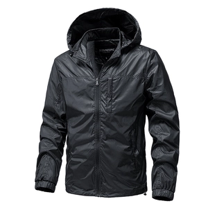 Detail of hooded jacket showing ripstop texture and front zippered pocket in black