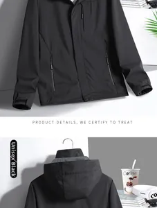 Detail view of black outdoor hooded jacket featuring functional zippers and adjustable cuffs