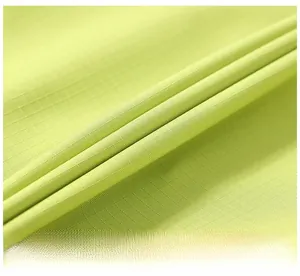 Macro shot of fruit green ripstop fabric texture for mens workwear shorts