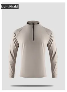 Detail of light khaki sports top featuring raglan sleeves and reflective safety strips