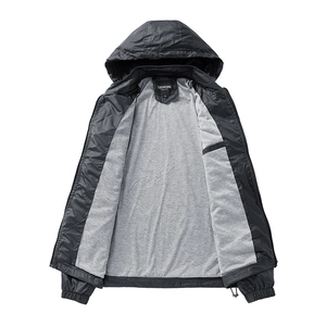 Detail of the hooded jacket featuring soft grey knit lining and black windproof fabric texture