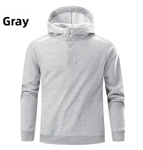 Detail of grey hoodie showing button placket neckline and white stripes on shoulders