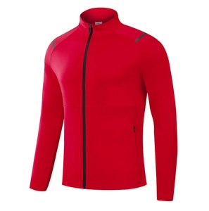Detail view of red athletic jacket showing black zipper and gray reflective shoulder strips