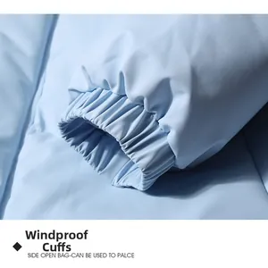 Detail of elastic windproof cuffs on a light blue winter jacket with matte texture
