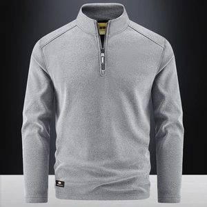 Men's grey half-zip fleece pullover with stand collar and premium knit texture style