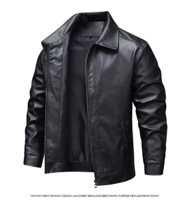 Detailed close-up of men's black leather jacket featuring classic lapel and smooth zipper