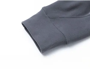 Close-up of flat elastic cuffs on a dark grey men's sports sweatshirt with soft texture