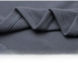 Macro detail of high-quality four-needle six-thread stitching on grey athletic sweatshirt