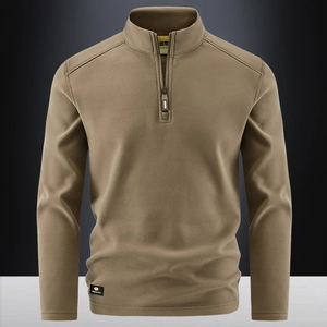 Men's tan half-zip fleece pullover with a structured stand collar and sports label
