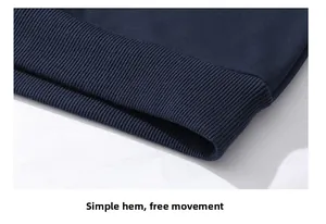 Detailed close-up of the elastic ribbed hem on a dark blue men's fleece hoodie sweater