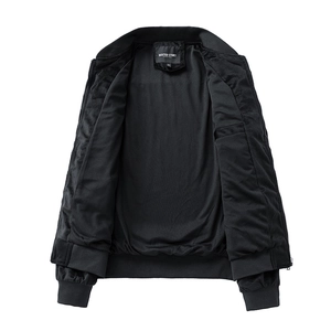 Detail view of black bomber jacket interior with brand label and inner welt pocket